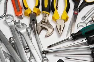 Set of tools for repair in a case on a white background. Assorted work or construction tools. Wrenches, Pliers, screwdriver. Top view photo