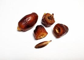 Close up of dried dates fruit isolated on white background photo