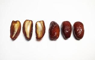 Close up of dried dates fruit isolated on white background photo