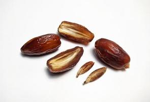 Close up of dried dates fruit isolated on white background photo