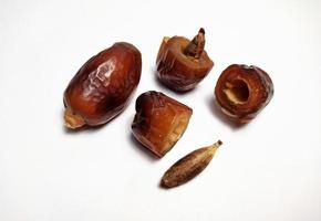 Close up of dried dates fruit isolated on white background photo