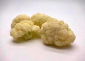 cauliflower pieces isolated in white background photo
