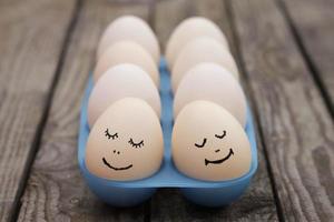 Happy couple in love. Eggs. photo