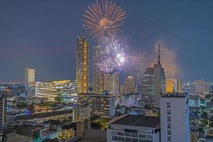 Aerial view of a fireworks display over the Chao Phraya River in Bangkok photo