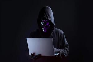 un hacker en un capucha utilizando un ordenador portátil computadora aislado en oscuro antecedentes con neón ligero. ai generado foto