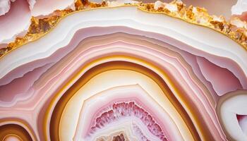 , natural volcanic agate stones close-up light pink magenta and golden texture. Wallpaper background, quartz marble, decorative rock pattern photo