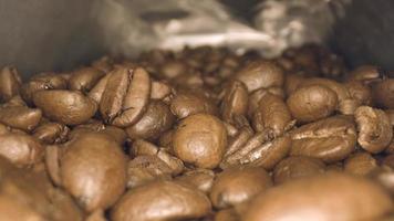 Close up macro video of camera traveling over brown coffee beans