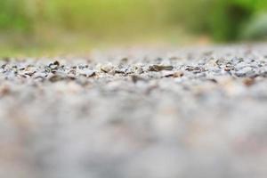 Selective Focus on Pebbles of Gravel ground in natural sunlight Background photo