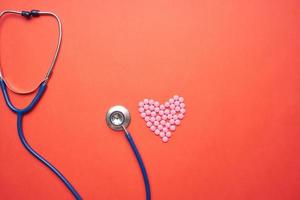 Stethoscope on red background photo