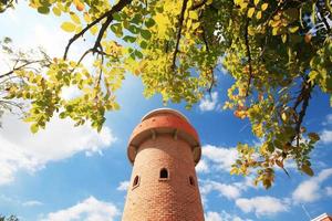 Beautiful brick stone tower is architecture roman stytle landmark in the garden and park at Thailand. photo