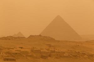 view on Menkaure pyramid in Giza at sandy storm photo