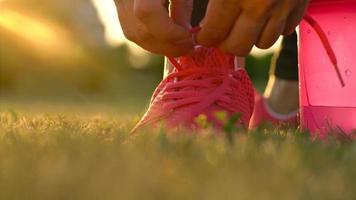 Running shoes - woman tying shoe laces video