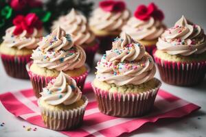 Colorful cupcakes on a white plate on a wooden table. Homemade cupcake with nuts and honey. photo