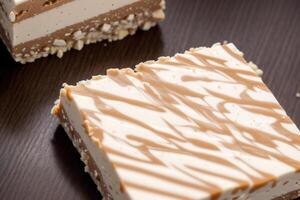 Close up of a chocolate nougat on a wooden table. photo