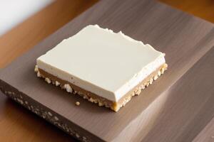 Close up of a chocolate nougat on a wooden table. photo