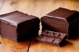 Chocolate bars and chocolate pieces on a wooden background, sweet food. Chocolate cake, Tiramisu cake. photo