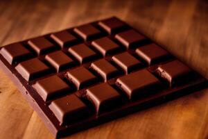 Chocolate bars and chocolate pieces on a wooden background, sweet food. Chocolate cake, Tiramisu cake. photo