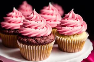 Colorful cupcakes on a white plate on a wooden table. Homemade cupcake with nuts and honey. photo