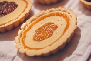 Delicious homemade tartlets on table, closeup. Delicious dessert. close up of a fresh baked apple tart. photo