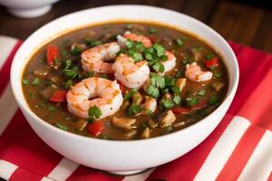 Curry with chicken and vegetables in a bowl on a wooden table. Gumbo. Vegetable soup. Seafood soup photo