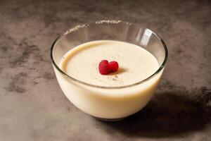 Delicious panna cotta with lemon and cocoa powder on wooden table. Dessert, sweet food. photo