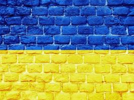 Ukrainian flag painted on brick wall photo