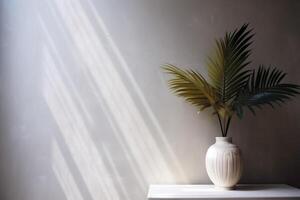 indoor view with pot and palm leaves photo