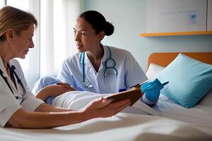 A nurse talks to a patient in a hospital bed. photo