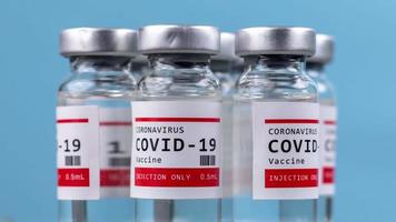 A macro video of glass vials of the covid-19 vaccine