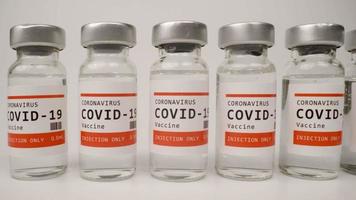 A macro video of glass vials of the covid-19 vaccine