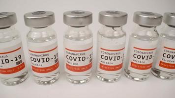 A macro video of glass vials of the covid-19 vaccine