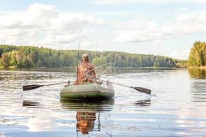 Fisherman in a boat photo