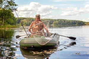 Fisherman in a boat photo