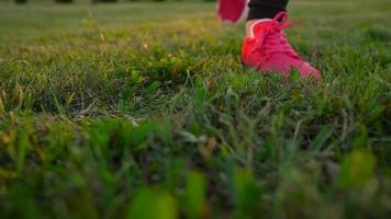 Running shoes - woman tying shoe laces. Slow Motion video