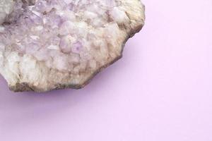 Natural violet amethyst druse geode mineral crystal unpolished semi-precious gemstone. Magic rock for ritual, witchcraft, spiritual practice, meditation. Esoteric life balance concept. Copy space photo
