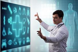 Medicine doctor and stethoscope in hand touching icon medical network connection with modern virtual screen interface, medical technology network concept and two doctor photo