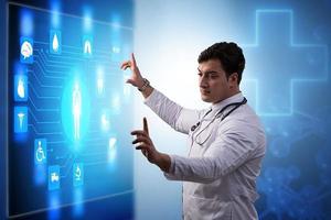 Medicine doctor and stethoscope in hand touching icon medical network connection with modern virtual screen interface, medical technology network concept and two doctor photo
