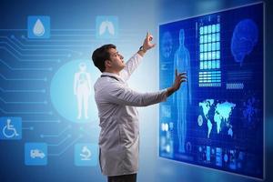 Medicine doctor and stethoscope in hand touching icon medical network connection with modern virtual screen interface, medical technology network concept and two doctor photo