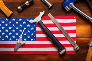 Labor day. hand tools and the flag of the united states of america lying on the table. photo