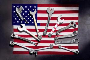 Labor day concept. Different kinds on wrenches and wooden cubes on table. photo