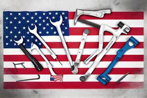 Happy labor day,Top view of flat lay of different kinds wrenches with american flag. photo