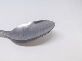 A close up of spoon with white background photo