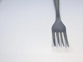 A close up of fork with white background photo