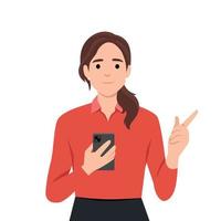 Smiling young woman hold cellphone point at screen. Happy girl with smartphone in hands show with finger at camera make choice vector