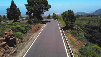 Top view of a car rides along a mountain road on Tenerife, Canary Islands, Spain. Way to the Teide volcano, Teide video