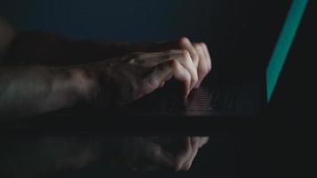 Hands of woman office worker typing on the keyboard at night video