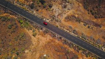 Top view of a car rides along a desert road on Tenerife, Canary Islands, Spain video