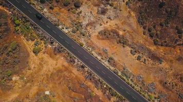 Top view of a car rides along a desert road on Tenerife, Canary Islands, Spain video