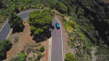 Top view of a car rides along a mountain road on Tenerife, Canary Islands, Spain. Way to the Teide volcano, Teide video