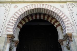 Arch in Mosque - Cathedral of Cordoba in Spain photo